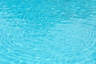 Photo of Clear refreshing water in swimming pool, closeup