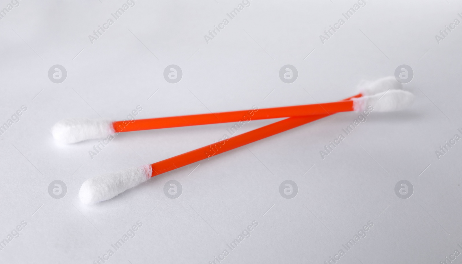 Photo of Clean cotton buds on white background. Hygienic accessory