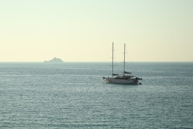 Photo of Picturesque view of calm sea with yacht on summer day