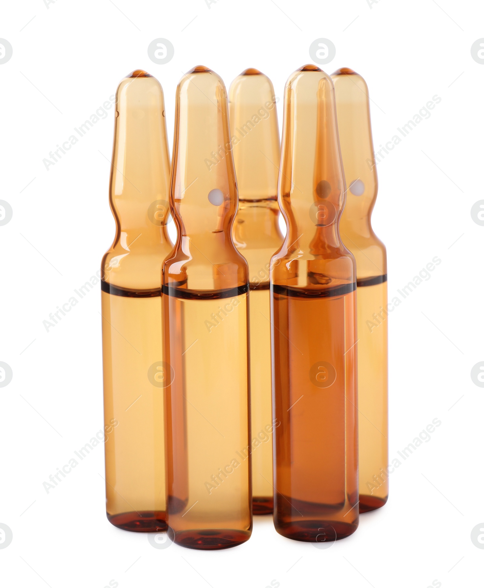 Photo of Brown pharmaceutical ampoules with medication on white background