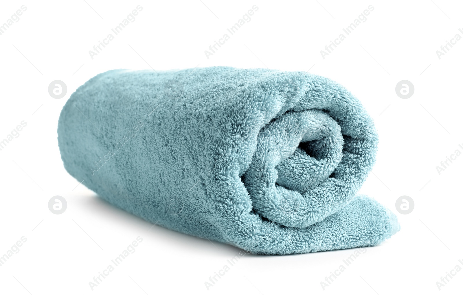 Photo of Rolled soft terry towel on white background