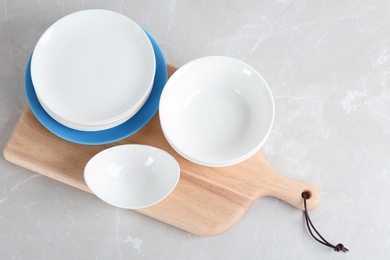 Photo of Flat lay composition with ceramic dishware on table