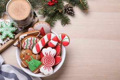 Photo of Delicious Christmas cookies on wooden table, flat lay. Space for text