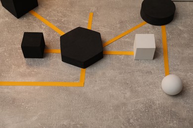 Photo of Business process organization and optimization. Scheme with geometric figures on grey table