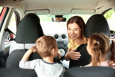 Photo of Happy family with children taking road trip together