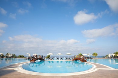 Photo of Beautiful landscape with blue sky and swimming pool at resort