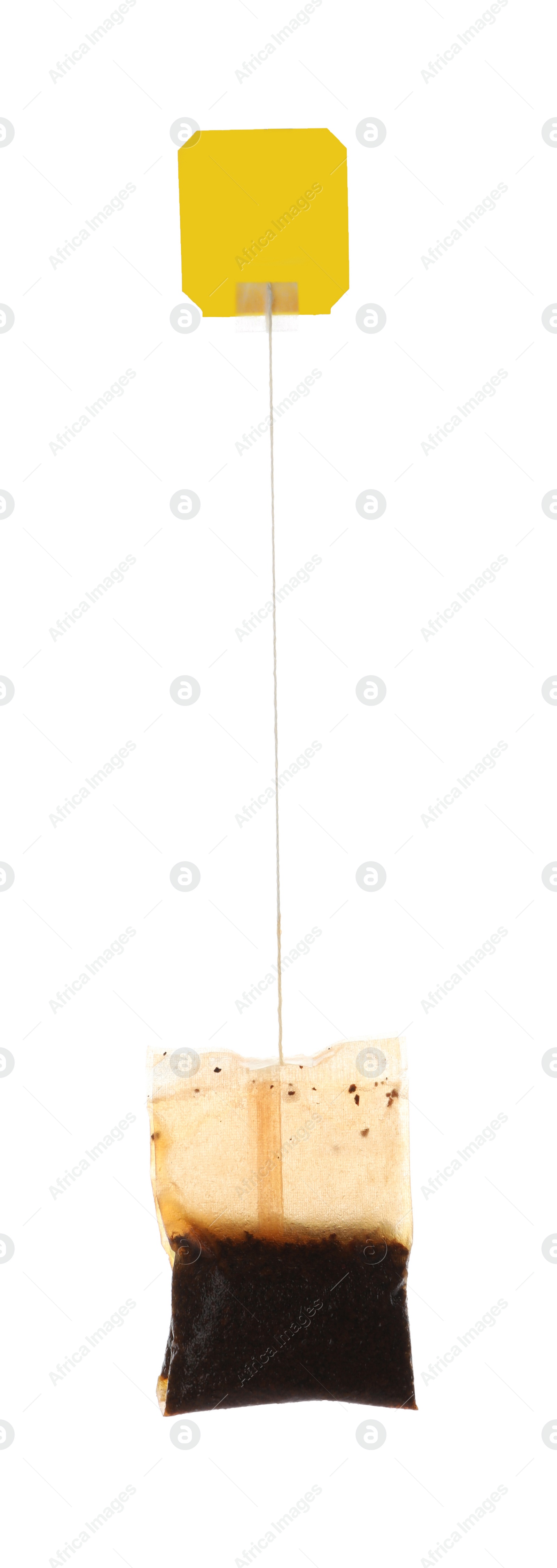 Photo of Used tea bag with tag isolated on white