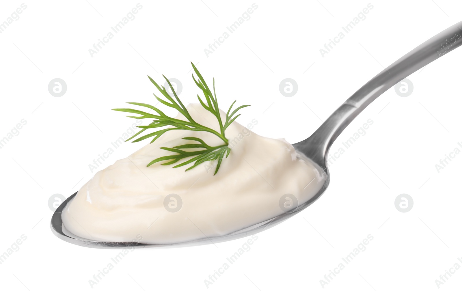 Photo of Delicious sour cream with dill in spoon on white background