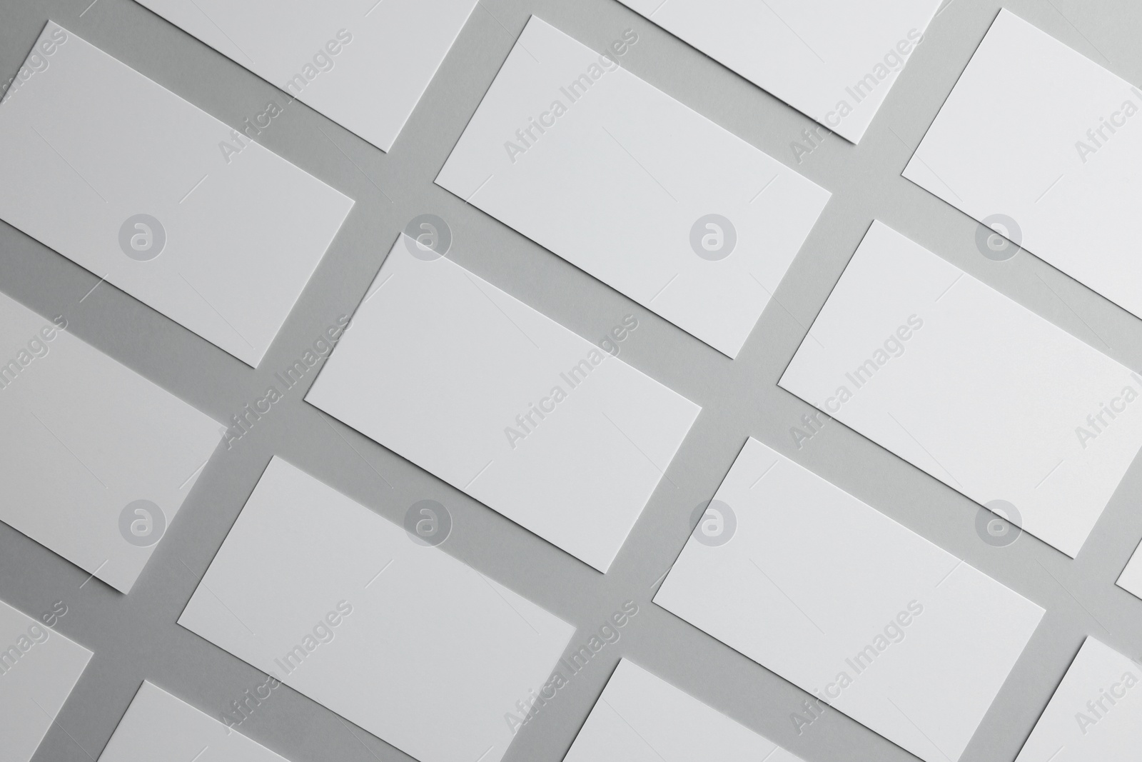 Photo of Blank business cards on light gray background, flat lay. Mockup for design