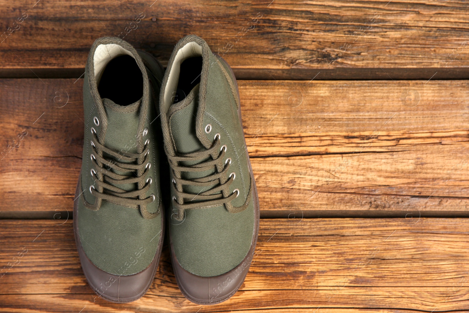 Photo of Pair of shoes on wooden background