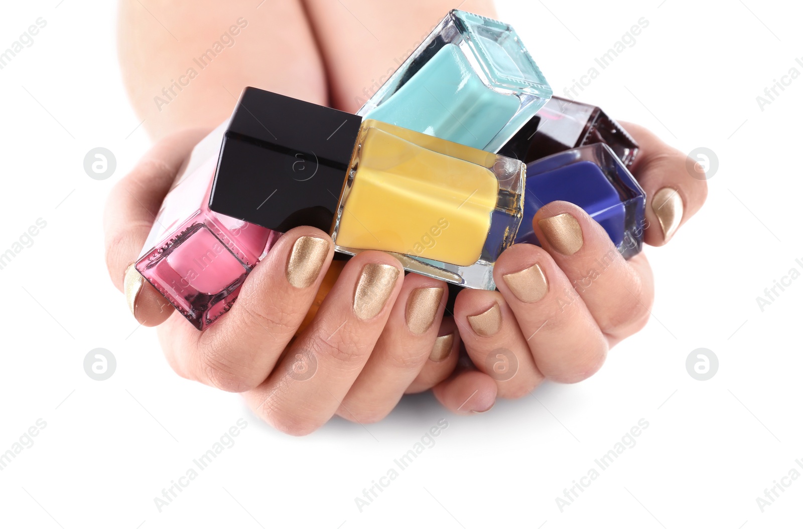 Photo of Woman holding nail polish bottles isolated on white, closeup