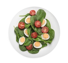 Photo of Delicious salad with boiled eggs, tomatoes and spinach isolated on white, top view