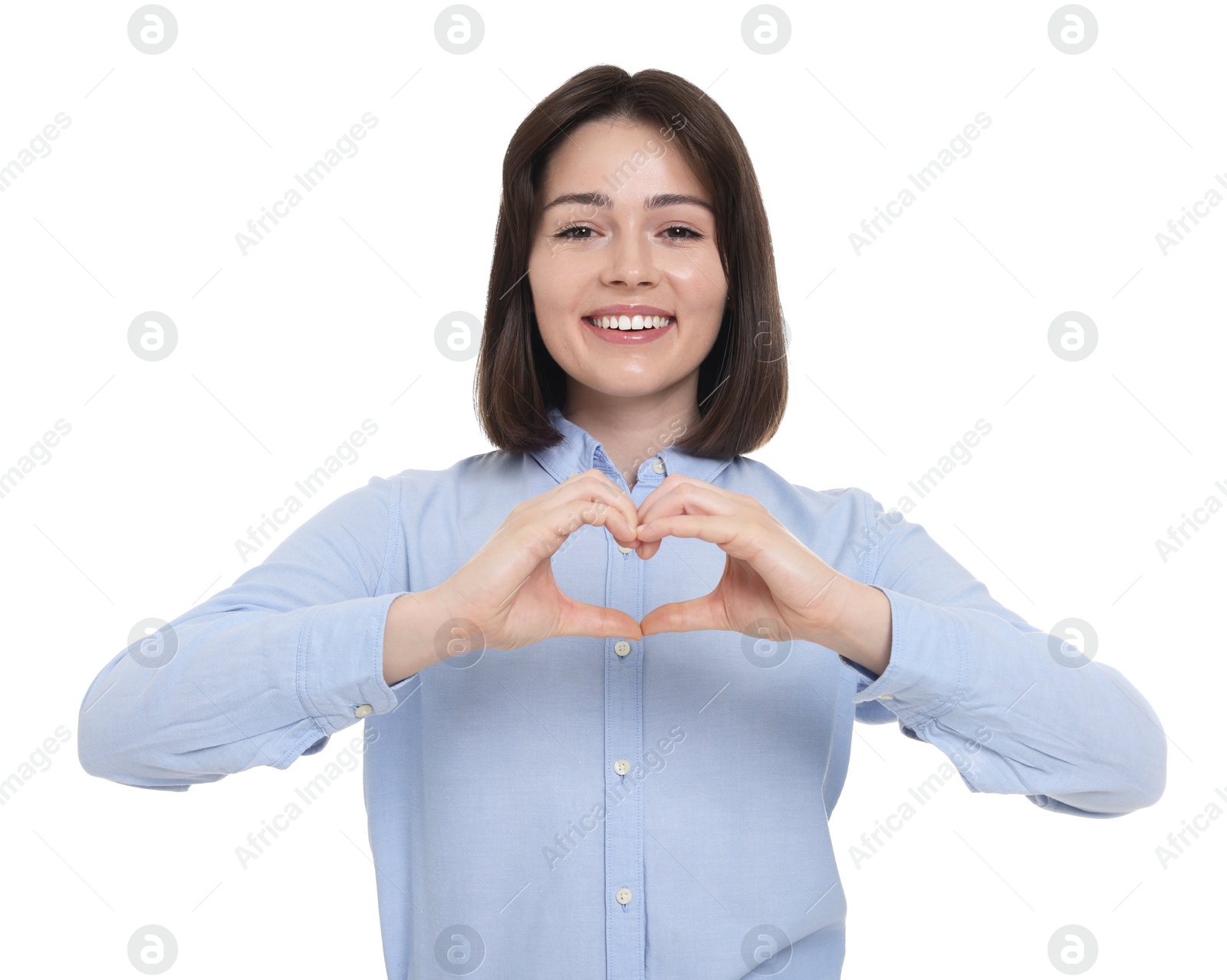 Photo of Happy woman showing heart gesture with hands on white background