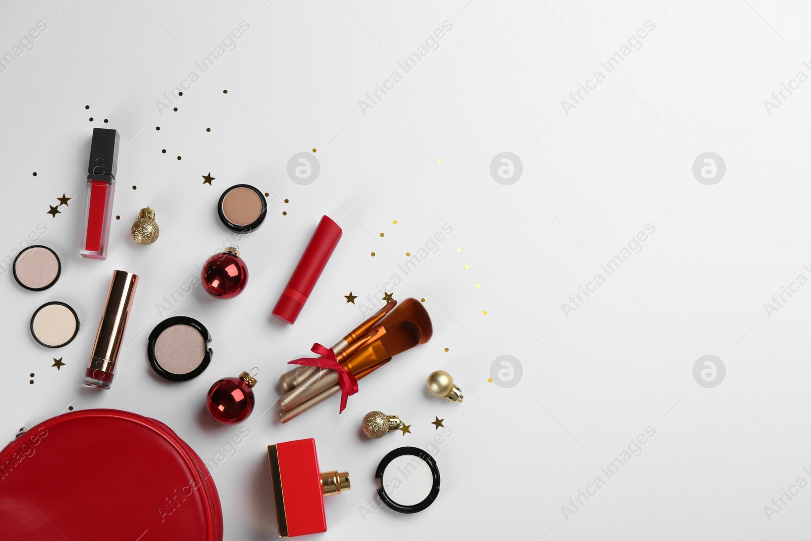 Photo of Flat lay composition with decorative cosmetic products and bag on light background. Winter care. Space for text