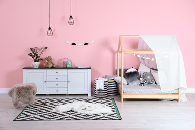 Photo of Modern child's room interior with cute bed