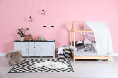 Modern child's room interior with cute bed