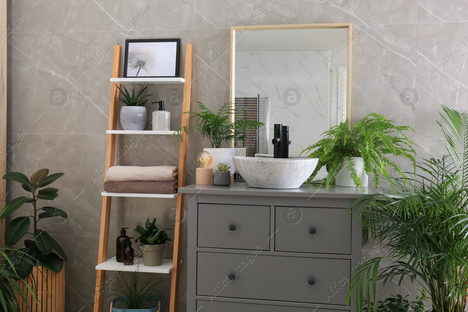 Photo of Modern bathroom interior with stylish vessel sink and beautiful green houseplants
