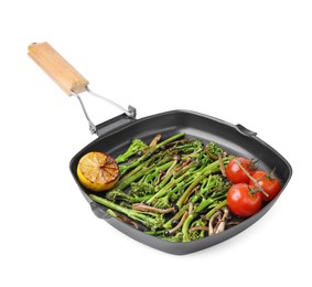 Photo of Grill pan with tasty cooked broccolini, mushrooms, tomatoes and lemon isolated on white
