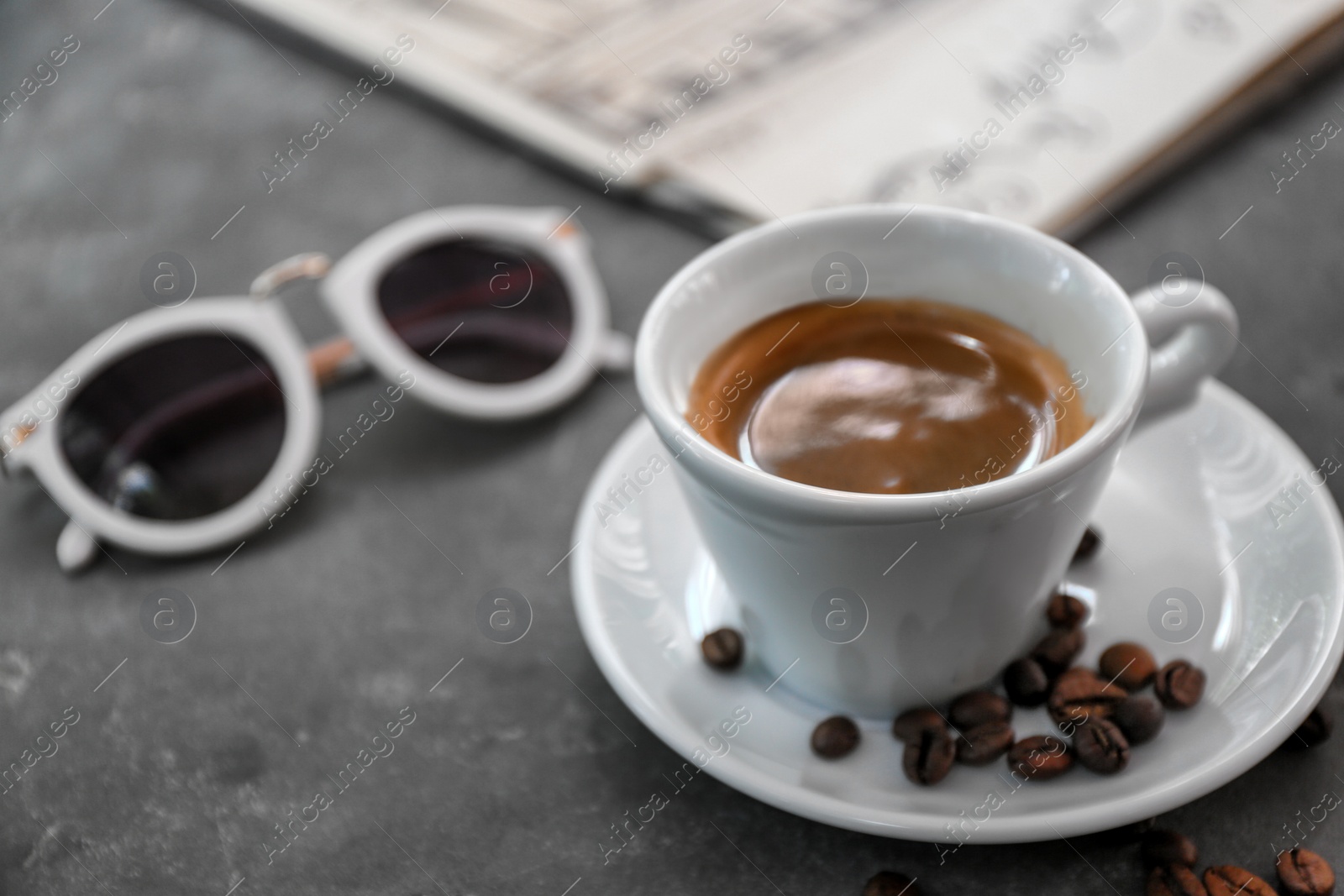 Photo of Cup of fresh aromatic coffee on table