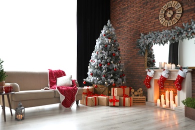 Stylish room interior with beautiful Christmas tree