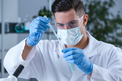 Photo of Scientist working with sample in chemical laboratory