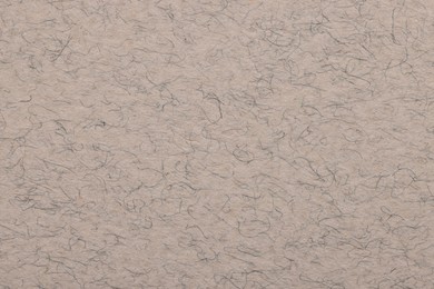 Photo of Texture of light grey paper sheet as background, top view