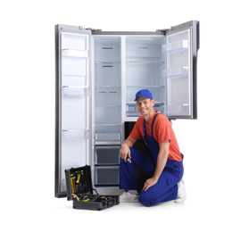 Photo of Male technician with tool box near refrigerator on white background