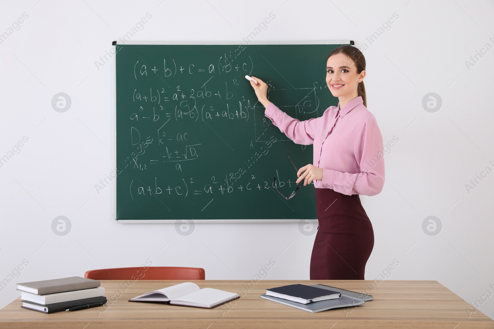 Photo of Portrait of young female teacher in classroom