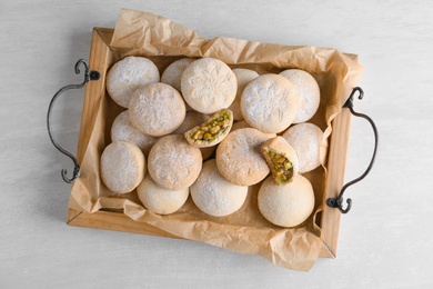 Traditional cookies for Islamic holidays on wooden background, top view. Eid Mubarak