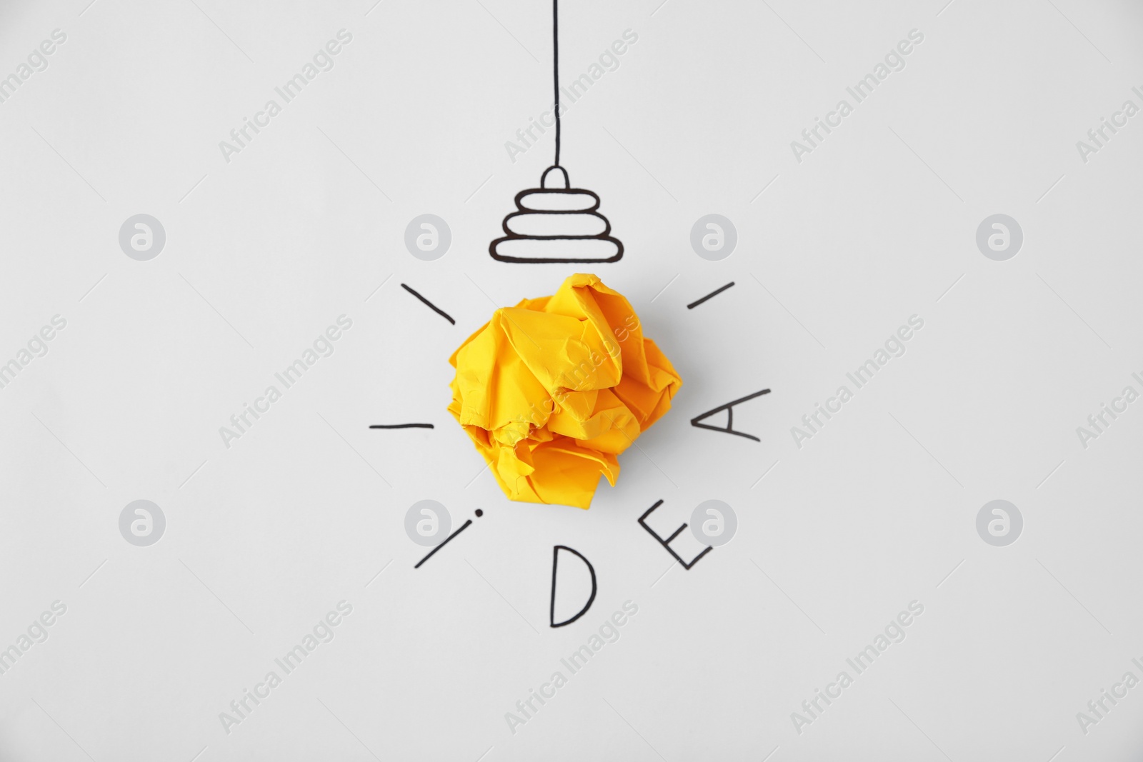 Photo of Composition with crumpled paper as lamp bulb and word IDEA on white background