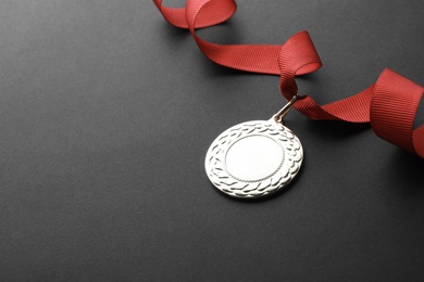 Gold medal with space for design on black background. Victory concept