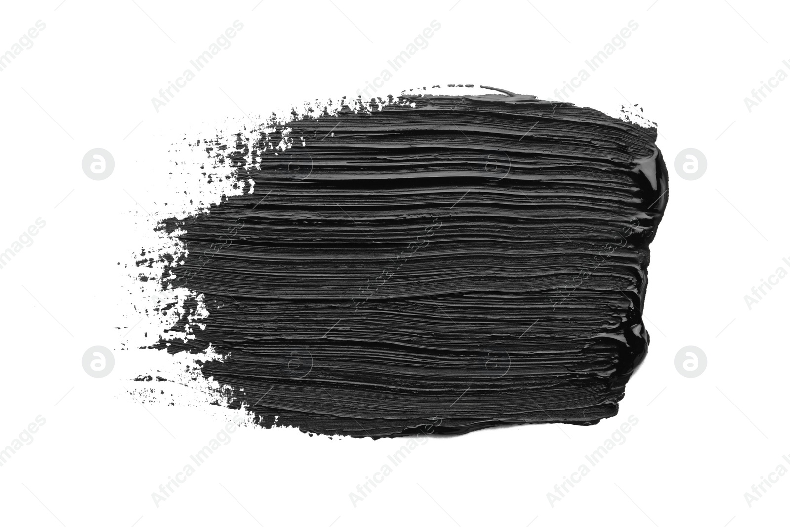 Photo of Brushstrokes of black oil paint on white background, top view