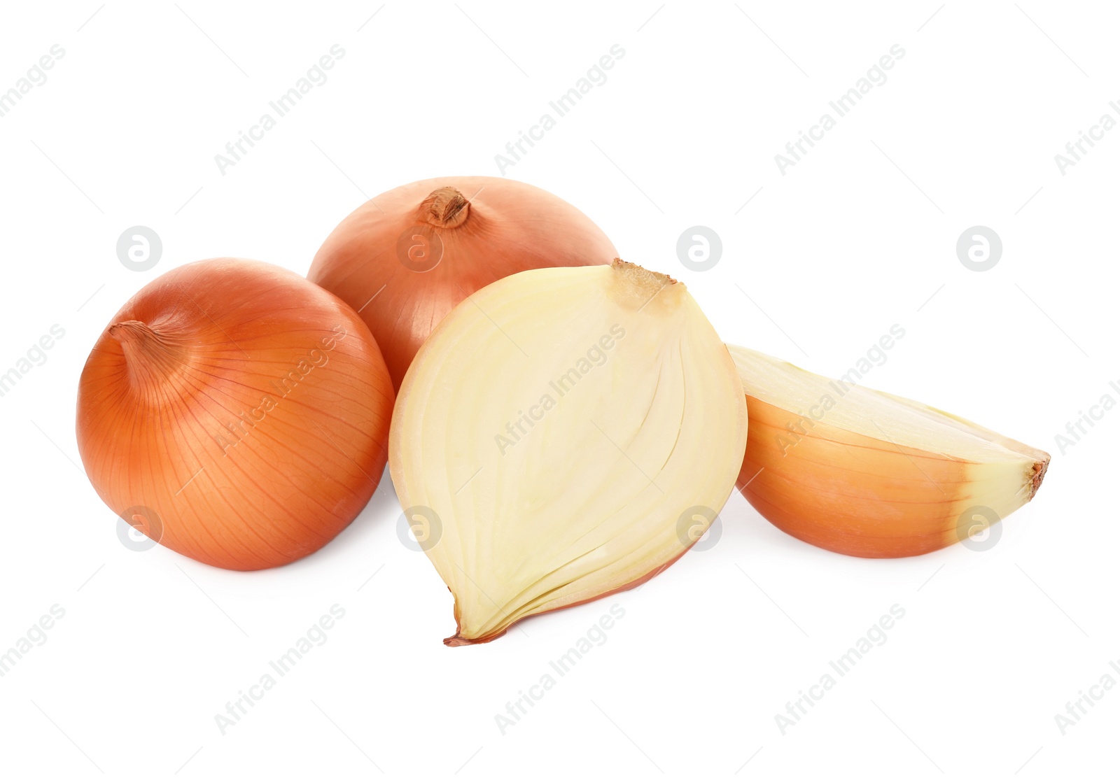 Photo of Whole and cut onions on white background