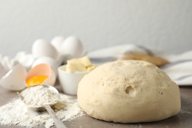 Wheat dough and products on table, closeup. Cooking pastries