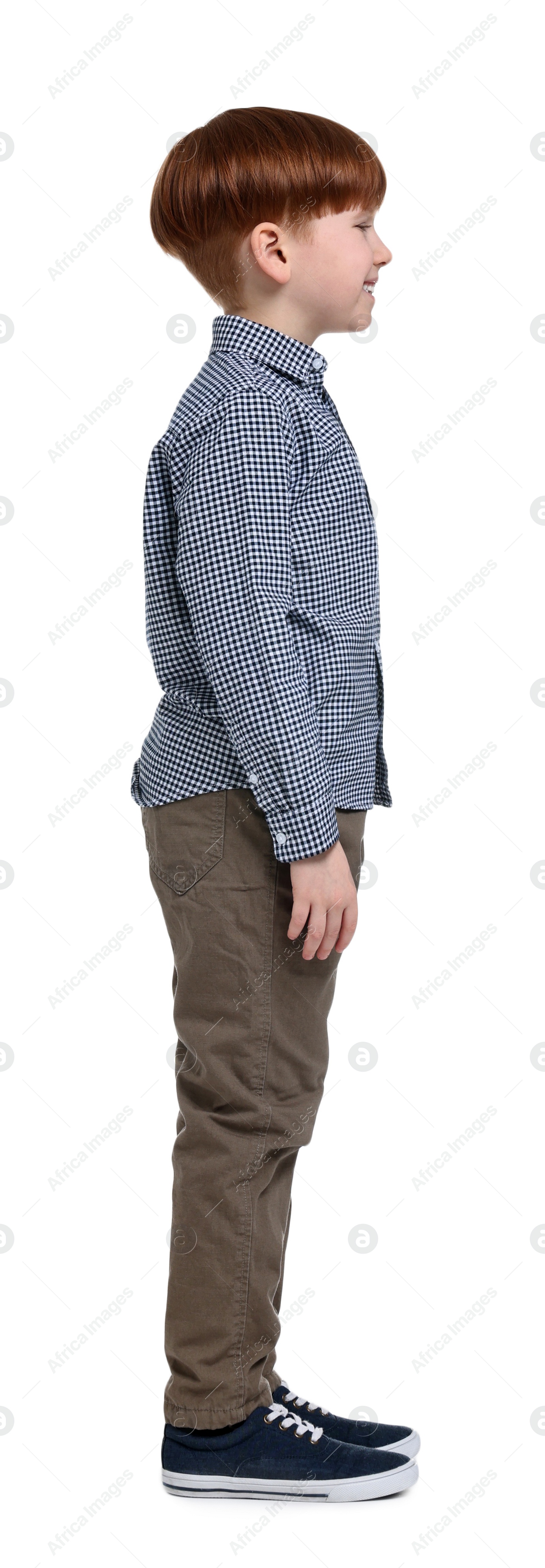 Photo of Little boy in shirt and pants on white background