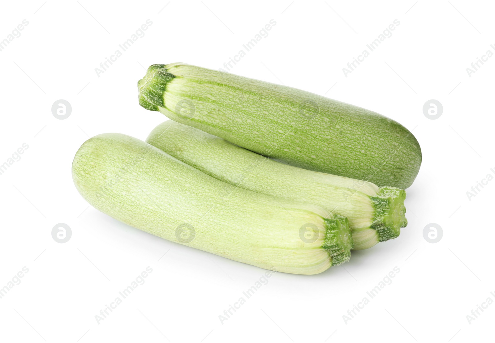 Photo of Raw green ripe zucchinis isolated on white