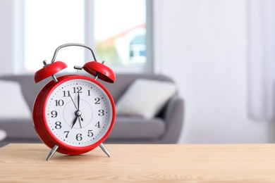 Alarm clock on table in living room. Time of day