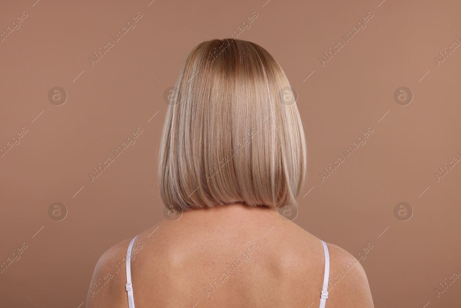 Photo of Woman with healthy skin on beige background, back view