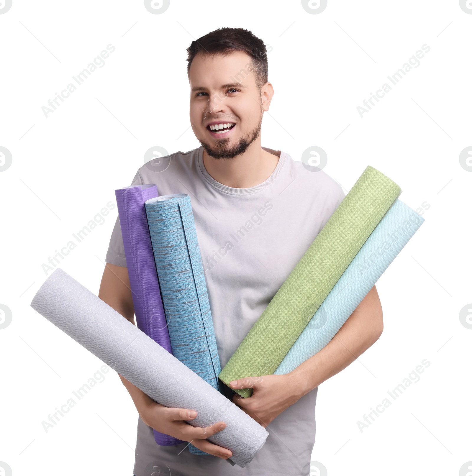 Photo of Man with wallpaper rolls on white background