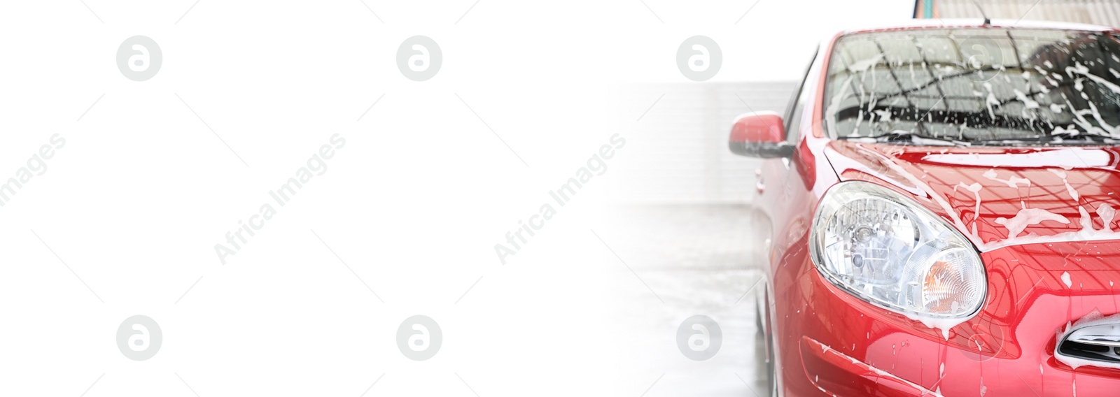 Image of Red auto with foam at car wash, space for text. Banner design