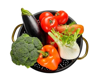 Photo of Colander with fresh vegetables isolated on white, top view