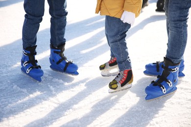 Photo of Family at outdoor ice skating rink, closeup