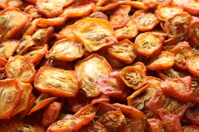 Photo of Cut dried kumquat fruits as background, closeup