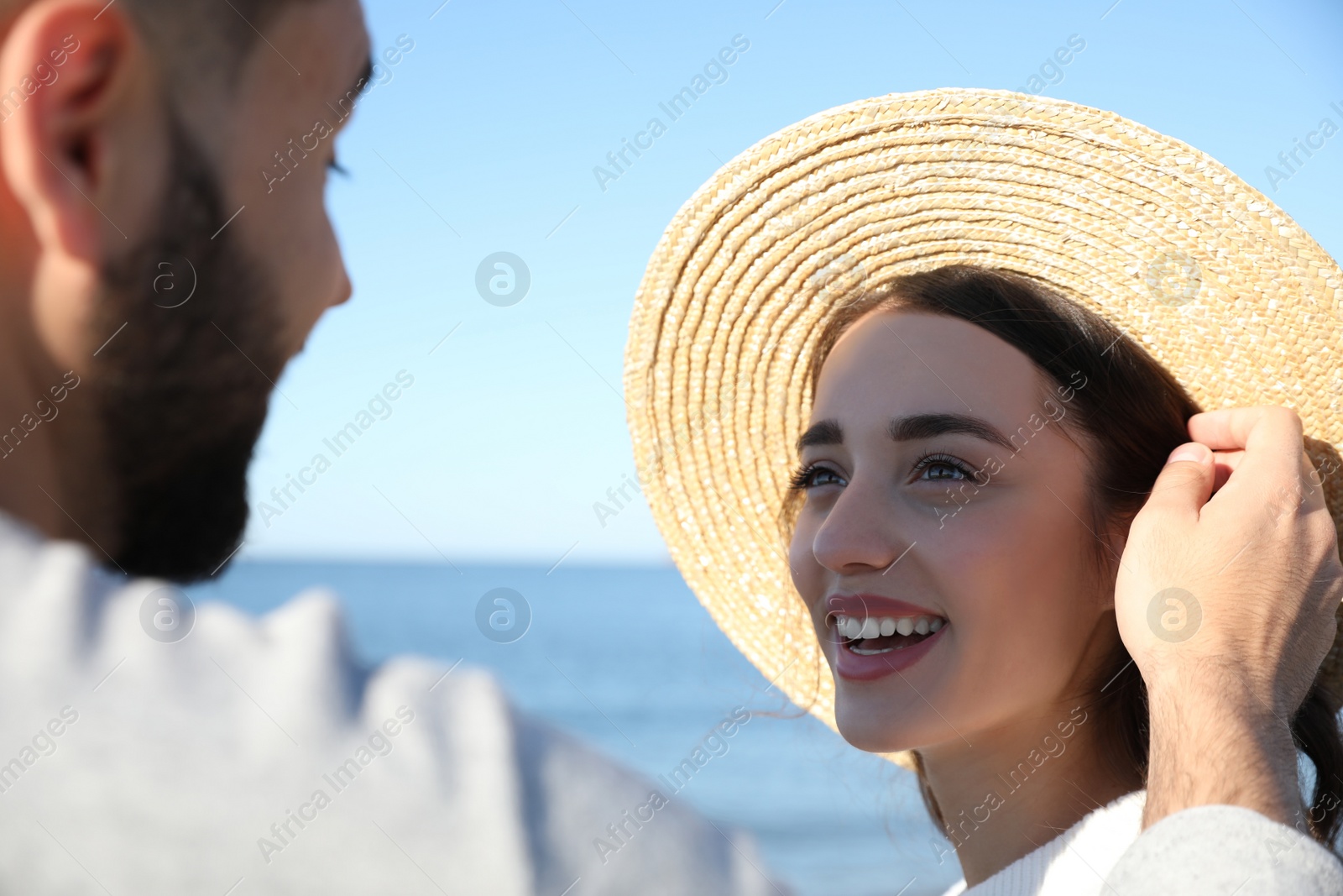 Photo of Happy young couple at beach. Honeymoon trip