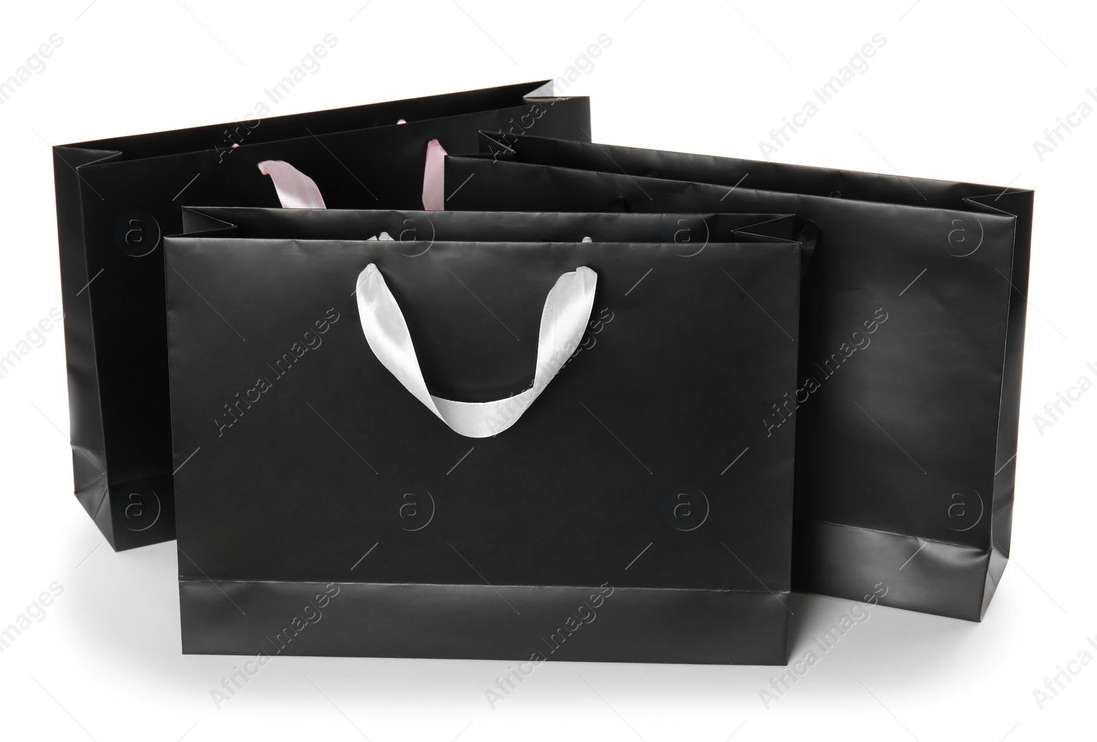 Photo of Paper shopping bags isolated on white. Mock up for design