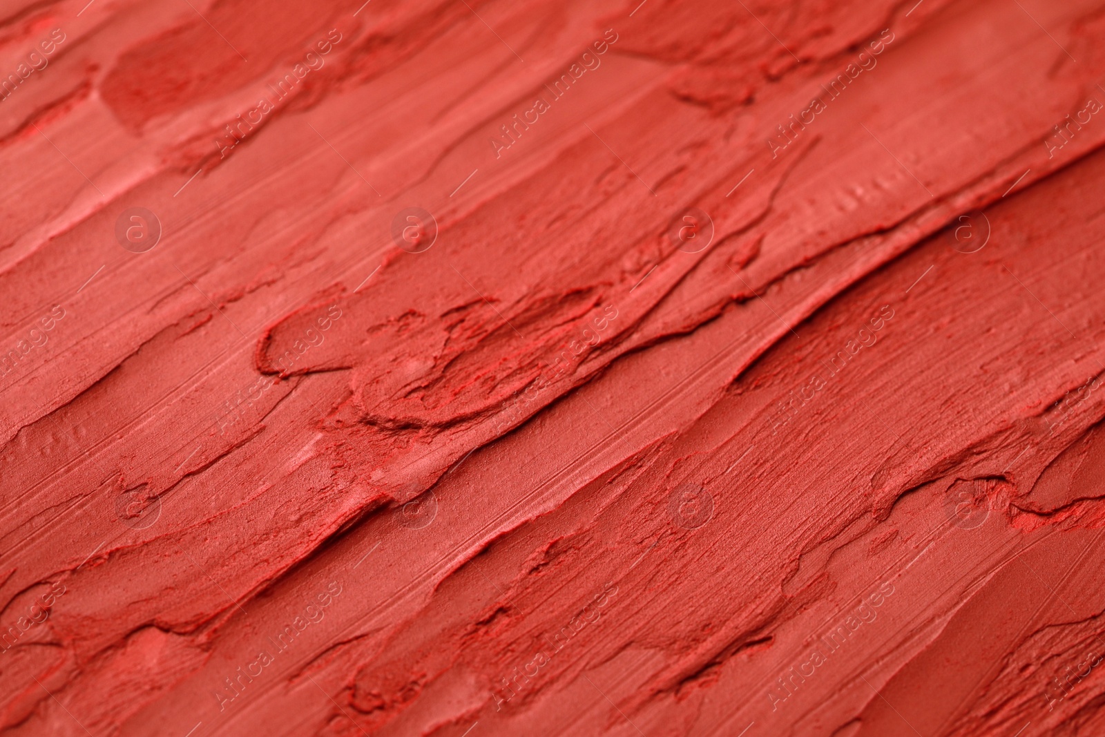 Photo of Texture of bright lipstick as background, closeup