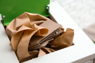 Photo of Trash bin with paper and cardboard, closeup. Recycling concept