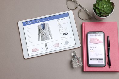 Photo of Online shopping. Flat lay composition with modern tablet and smartphone on grey background