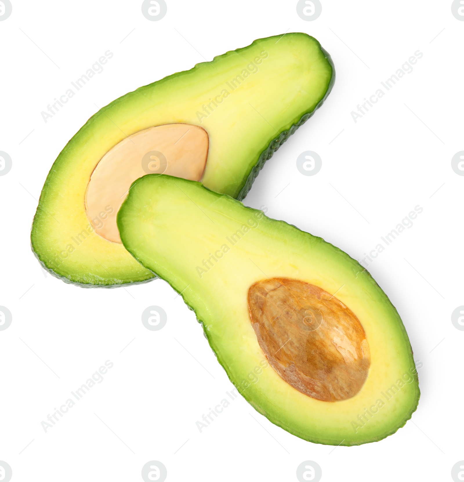 Photo of Cut tasty ripe avocados on white background, top view. Tropical fruit