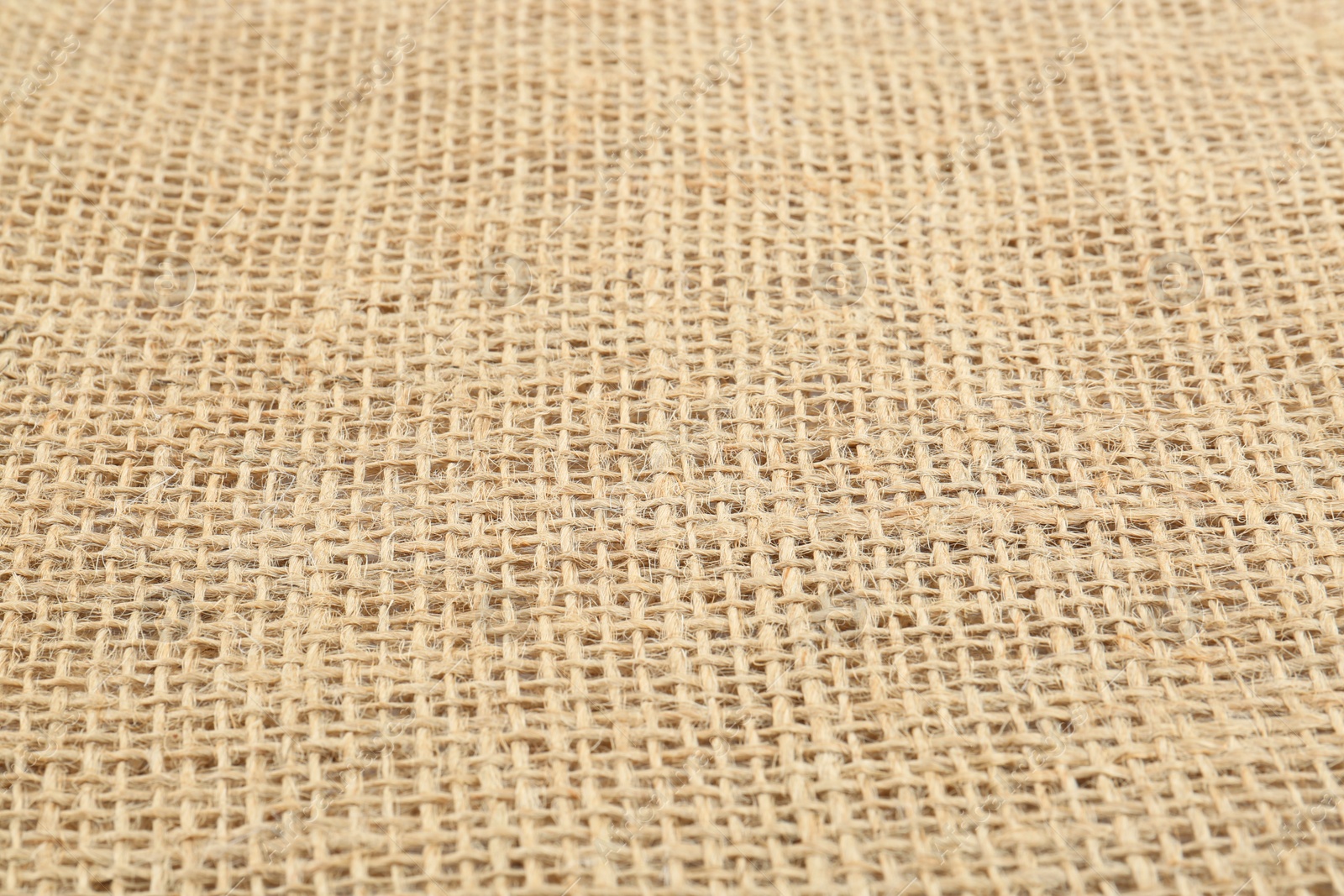 Photo of Texture of burlap fabric as background, closeup